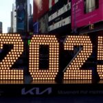 2025 numerals arrival in Times Square, symbolizing the upcoming New Year celebrations and the anticipation of dining out, optimized for local food searches.