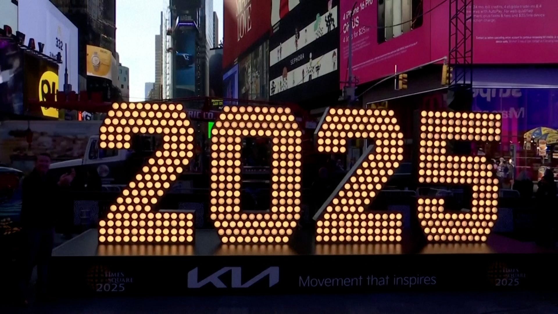 2025 numerals arrival in Times Square, symbolizing the upcoming New Year celebrations and the anticipation of dining out, optimized for local food searches.