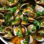 A close up view of a freshly caught Quahog clam, showcasing its size and texture.