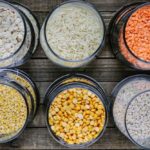 A colorful assortment of lentils and grains essential for making Haleem.