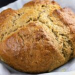 A loaf of Irish Soda Bread, showcasing its rustic crust and inviting texture.