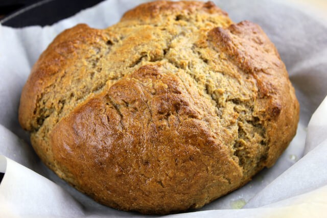 A loaf of Irish Soda Bread, showcasing its rustic crust and inviting texture.