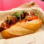 A massive Diablo Po'Boy sandwich with crispy shrimp and spicy Mexican butter sauce, a new food item at Angels Stadium section 207.