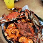 A quintessential Baltimore crab feast featuring steamed crabs.