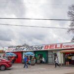 A vibrant and colorful interior shot of Mas Tacos Por Favor, showcasing its lively atmosphere in East Nashville