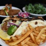 A vibrant and colorful plate of Indian food, showcasing the fresh and flavorful ingredients at Masala in Missoula MT