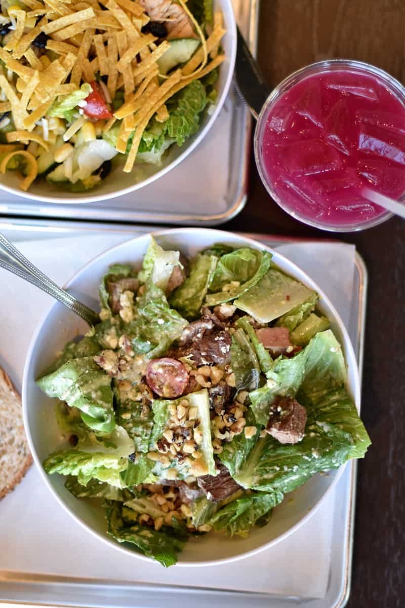 A vibrant and colorful Tuna Poke Bowl at CoreLife Eatery in American Fork, showcasing fresh tuna, greens, and toppings.