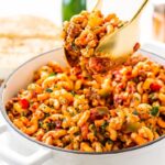 American Chop Suey, a comforting and straightforward dinner, combines ground beef, tomatoes, onions, green peppers, macaroni, and spices. This stovetop classic is ready in 30 minutes, perfect for a quick weeknight meal!