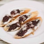 Anchovies with black olive tapenade served as pintxos in San Sebastian.