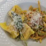 Assortment of tortelli and gramigna pasta at Da Serghei restaurant in Bologna