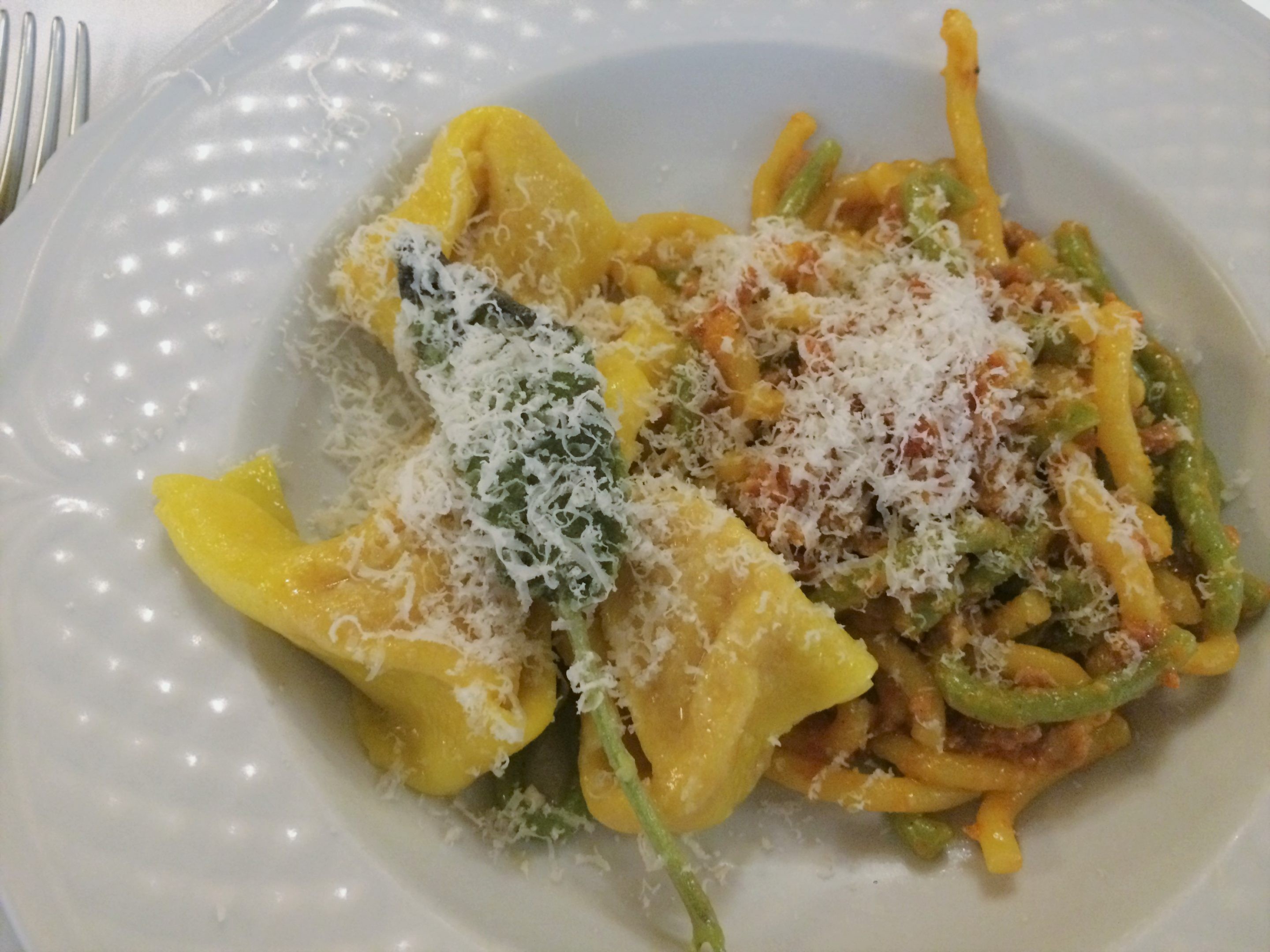 Assortment of tortelli and gramigna pasta at Da Serghei restaurant in Bologna