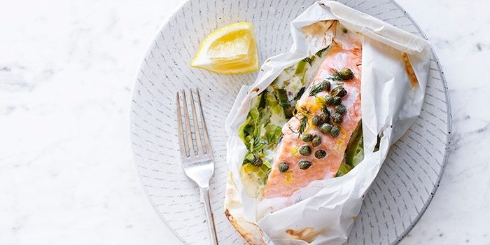 Baked salmon and leek parcel with capers and lemon