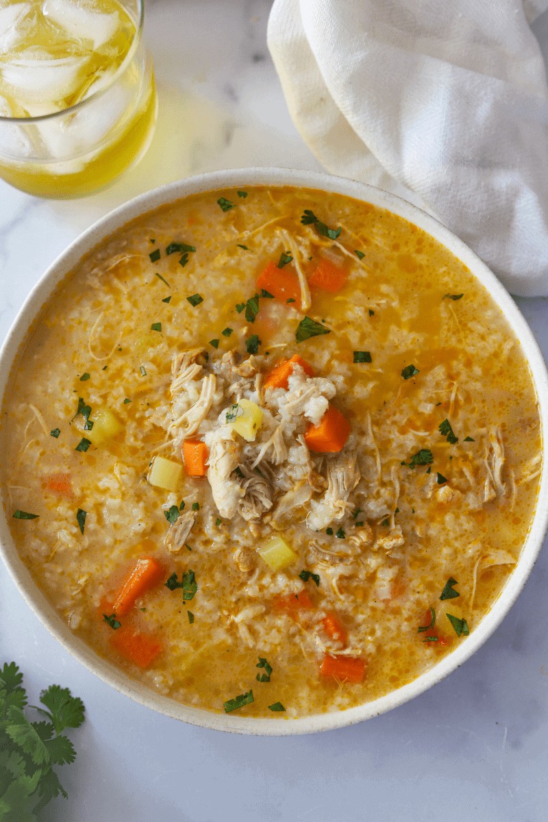 Bowl of Cape Verdean canja, a quintessential Cape Verde food comfort dish, garnished with parsley