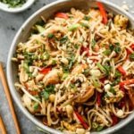 Bowl of homemade Pad Thai with vibrant ingredients.