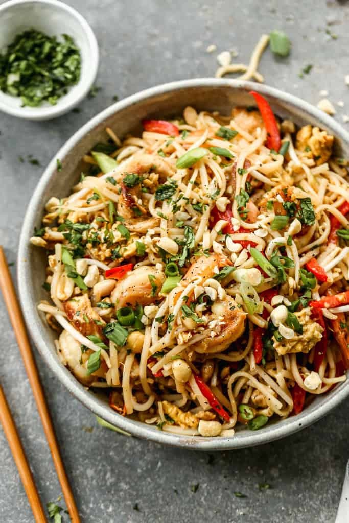 Bowl of homemade Pad Thai with vibrant ingredients.