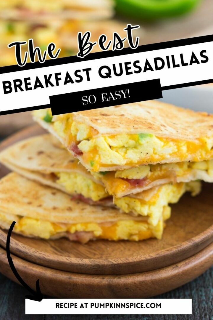 Breakfast quesadilla filled with eggs, bacon, cheese, and green peppers on a plate.