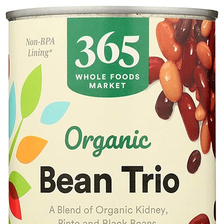 Cans of organic beans including kidney, pinto, and black beans, essential for online whole foods pantry orders