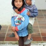 Children in Guatemala being cared for, highlighting community support and care.