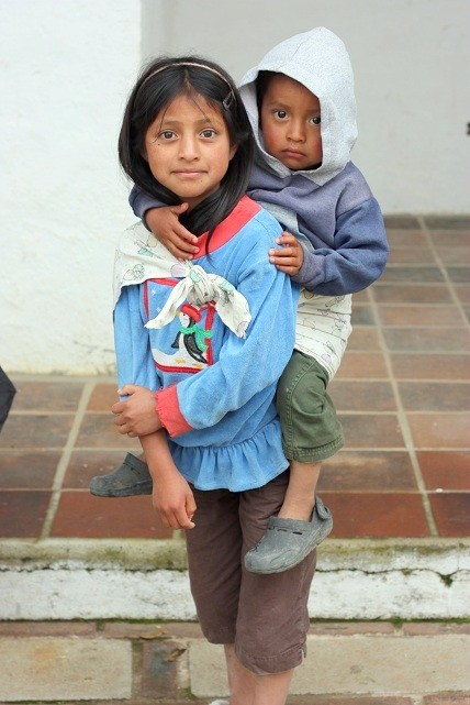 Children in Guatemala being cared for, highlighting community support and care.