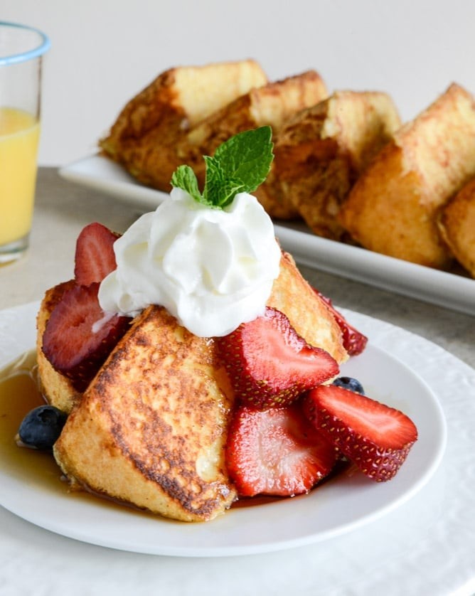 Close-up of golden Angel Food French Toast slices, stacked and inviting, showcasing its unique texture.