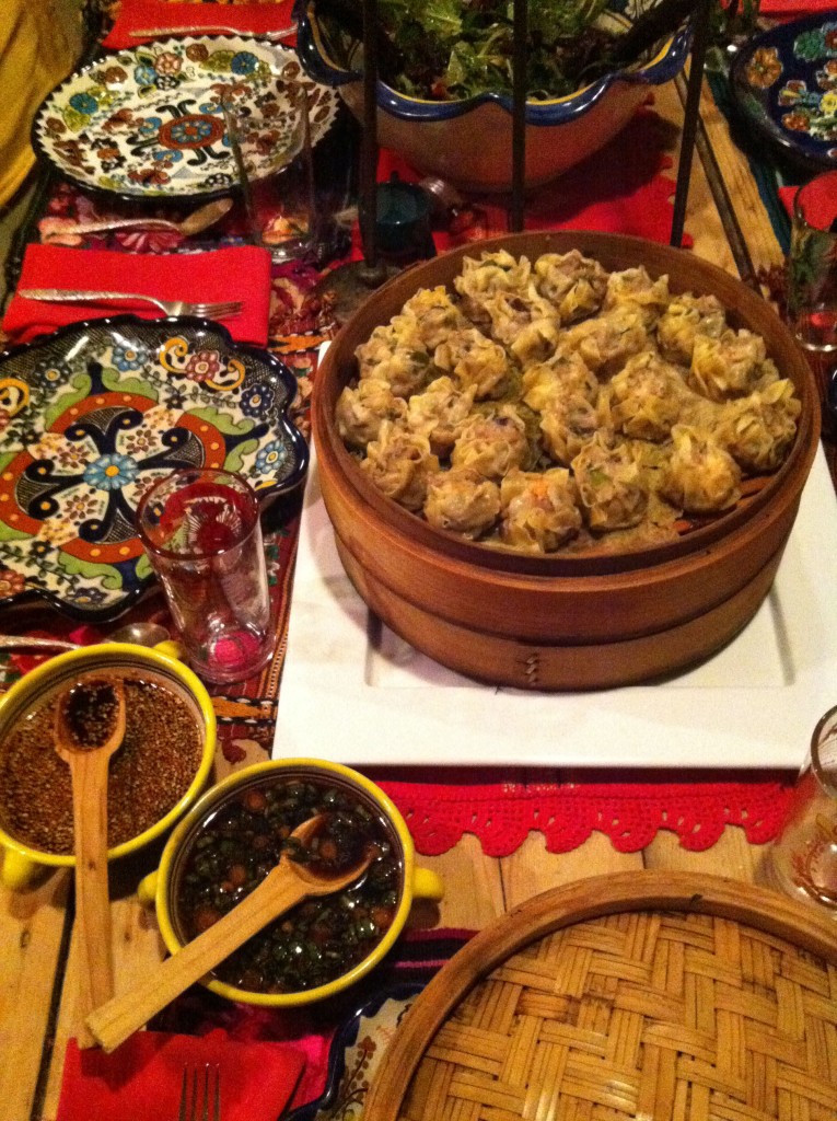 Close-up of Shu Mai dumplings in a bamboo steamer, showcasing the pleated tops and savory filling.