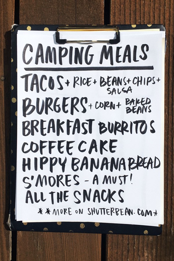 Close-up of taco ingredients laid out on a picnic table, ready for a camp taco night.