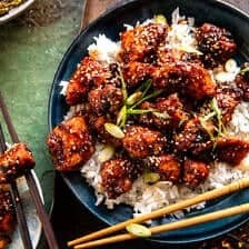 Close-up shot of 30 Minute Honey Garlic Chicken, emphasizing its crispy texture and honey garlic glaze, perfect for a fun and easy dinner