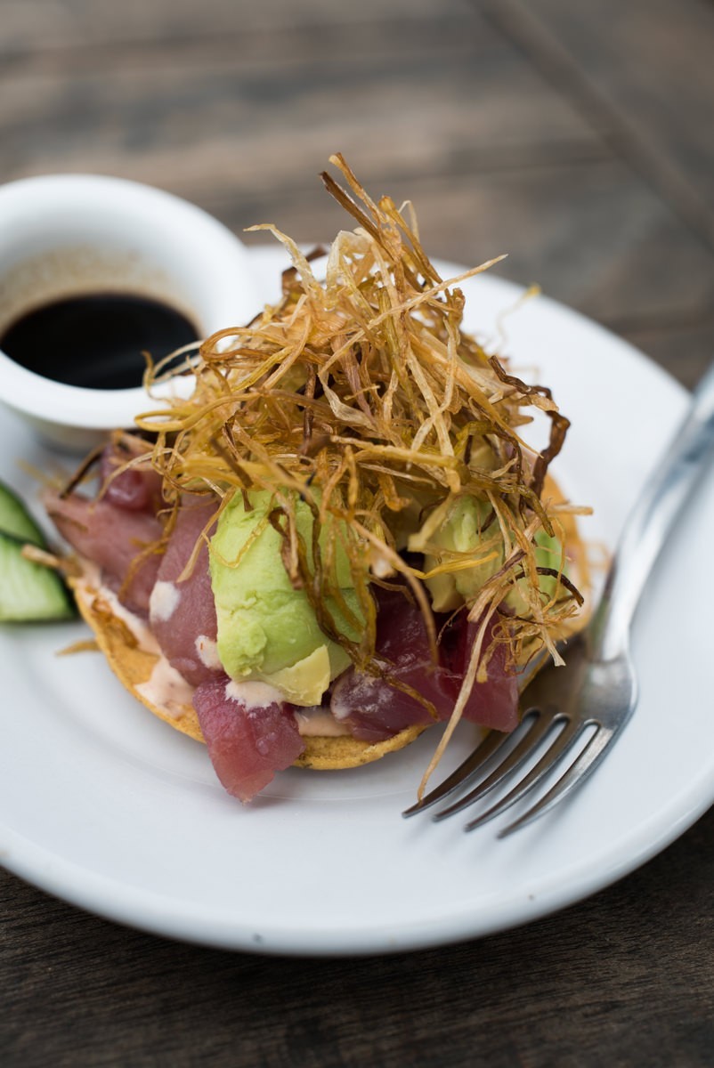 Coco's Beach Club's refreshing tuna ceviche tostada, perfect for beachfront dining