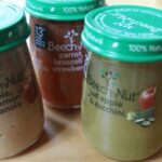 Collection of empty pear-shaped Beechnut baby food jars, showcasing their unique design perfect for crafting after removing labels.