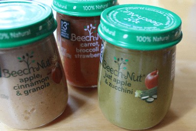 Collection of empty pear-shaped Beechnut baby food jars, showcasing their unique design perfect for crafting after removing labels.