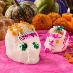 Colorful sugar skulls or calaveras, a popular day of the dead food, decorated for Dia de Muertos.