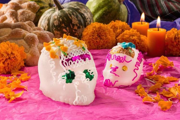 Colorful sugar skulls or calaveras, a popular day of the dead food, decorated for Dia de Muertos.
