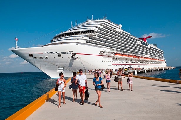 Cruise ship Carnival Dream docked in Cozumel, Mexico, showcasing the destination as a gateway to Mexican culinary adventures.