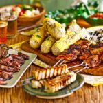 Delicious Brazilian barbecue featuring grilled meats, sausages, and cheese, a staple of Brazil foods.