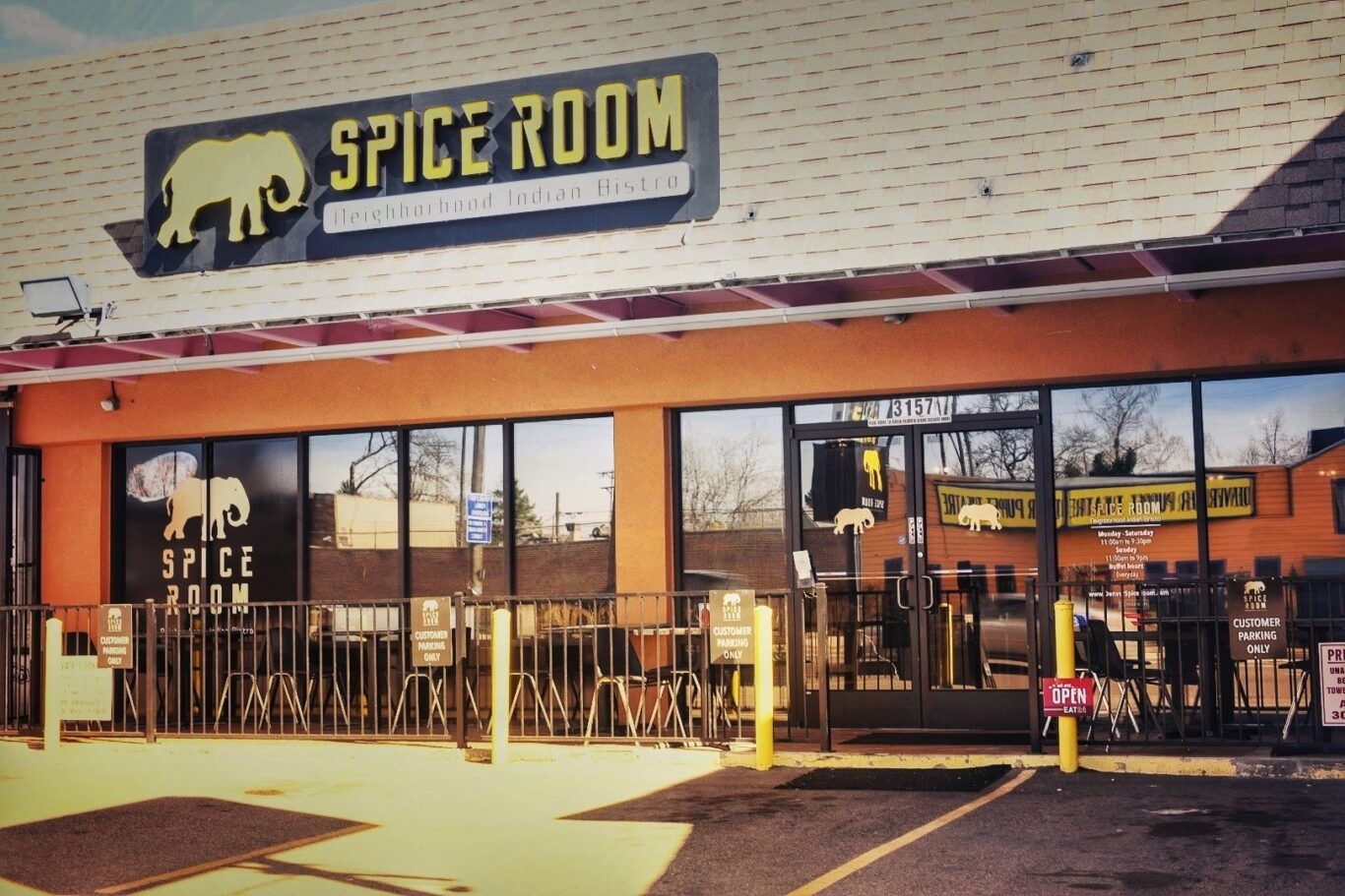 Delicious Indian food takeout at Spice Room Denver, featuring Chicken Tikka Masala and Basmati Rice