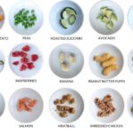 Diverse selection of first finger foods for babies arranged in a grid, showcasing colorful and nutritious options like fruits, vegetables, and soft cooked proteins.