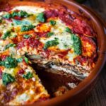 Eggplant Lasagna made with roasted eggplant, no-boil noodles, and Arugula Pesto. A comforting and healthy vegetarian dinner recipe.