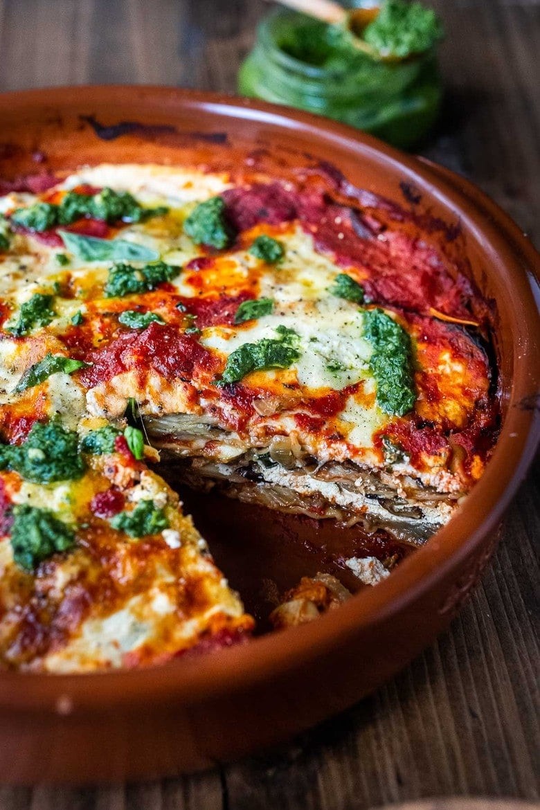 Eggplant Lasagna made with roasted eggplant, no-boil noodles, and Arugula Pesto. A comforting and healthy vegetarian dinner recipe.