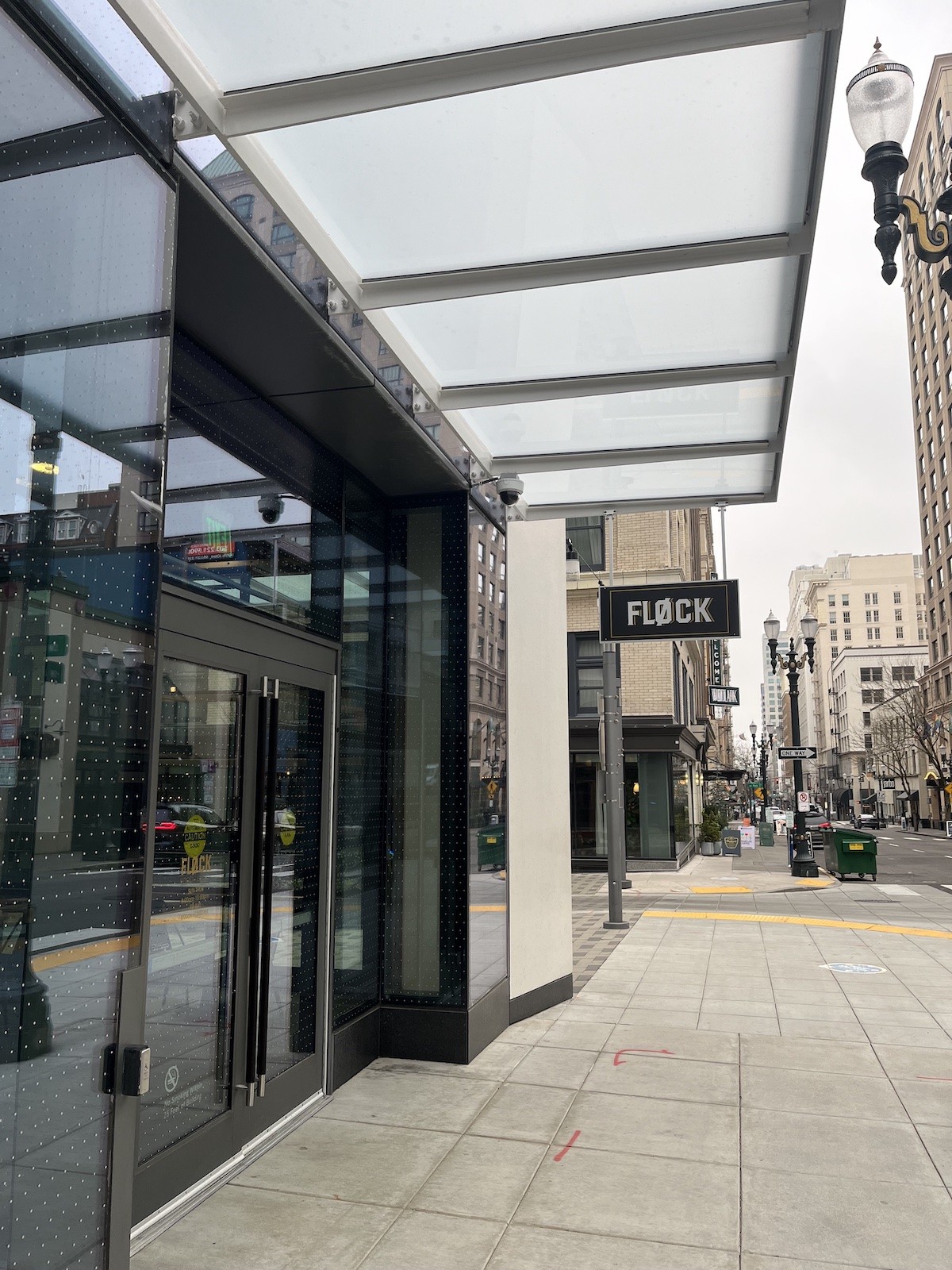 Entrance view of Flock Food Hall in Portland, Oregon, inviting visitors into its culinary space.