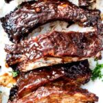 Fall-off-the-bone slow cooker barbecue ribs, perfect for game day feasting.