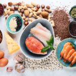 foods containing phosphorus, including nuts and seeds, salmon, eggs, cheese