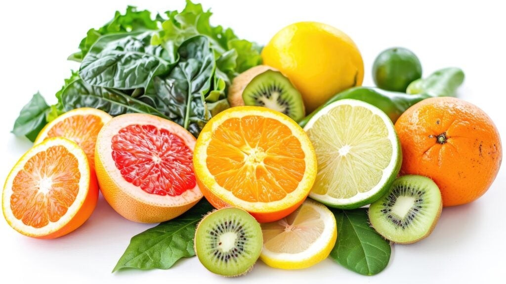 Foods that have vitamin C: A colorful assortment of fresh fruits and vegetables, including citrus fruits, bell peppers, and leafy greens, all rich in vitamin C.