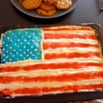 Fruit flag skewers for a themed potluck party.