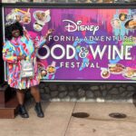 Guests enjoying the vibrant atmosphere of the Disneyland Food and Wine Festival 2024, exploring various food booths and tasting culinary delights.