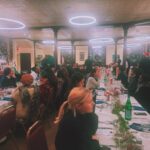 Holiday Soiree at Refettorio Harlem, showcasing community engagement and free food distribution.