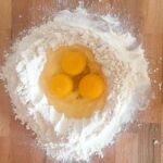 Ingredients for homemade pasta: eggs and flour