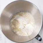 mixing flour, salt and oil for aloo paratha dough