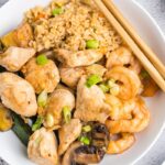 overhead of hibachi dinner plate with chicken, shrimp and veggies