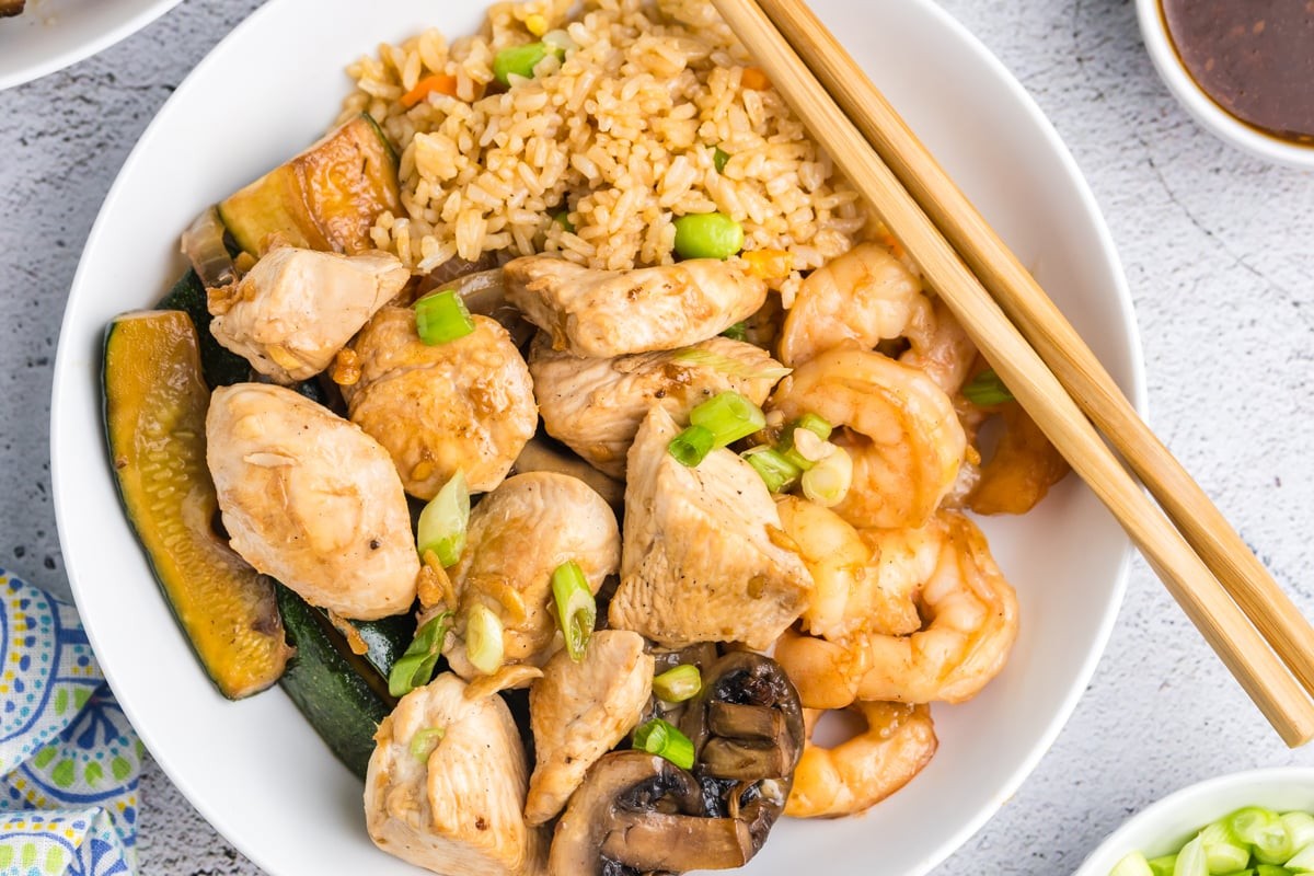 overhead of hibachi dinner plate with chicken, shrimp and veggies