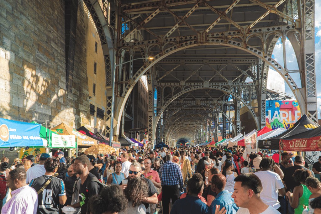 People eating and drinking at New York City Wine & Food Festival.